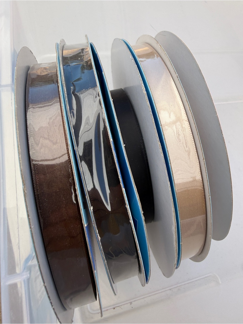 Set of Decorative Ribbon Spools in Brown, Black, Beige, White.